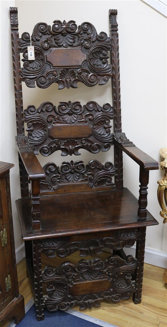 A 17th century Spanish style carved walnut throne chair, H.157cm
